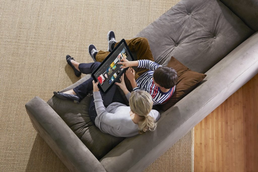 Mother and Son Using XPS 18 AIO on Couch