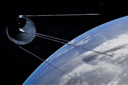 Satellite orbiting earth with clouds below