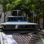 Self-driving car with sensors on city street
