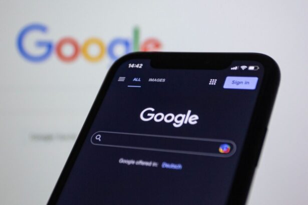 Smartphone screen showing Google search in dark mode with the Google logo in the background.