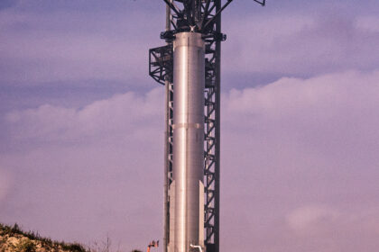 A SpaceX Super Heavy booster on the launch tower at Starbase, Texas