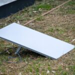 A Starlink satellite internet dish set up on the grass